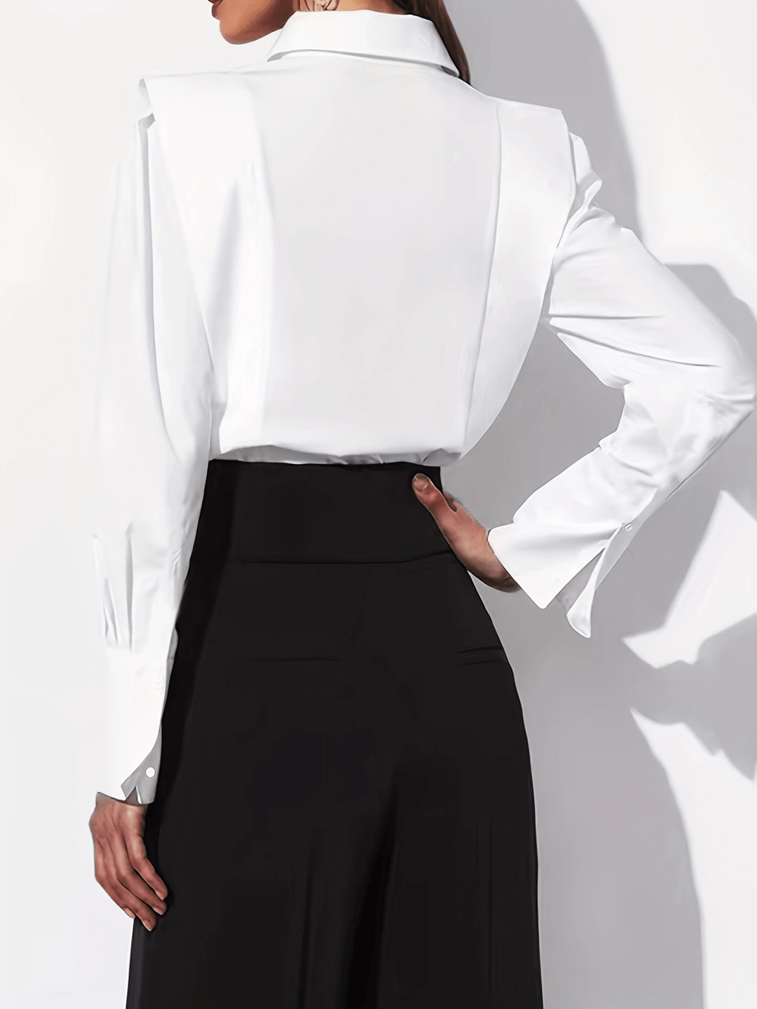Women's tailored long-sleeve button-up shirt with pointed collar