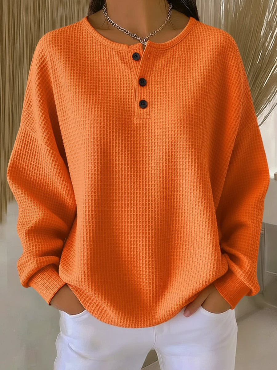 Women's waffle knit Henley top with long sleeves and button placket