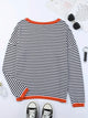 Women's striped turtleneck jumper with orange ribbed trim