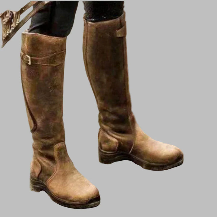 Women's tall riding boots with buckle strap and low heel