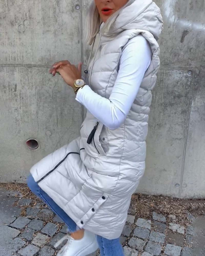 Women's white sleeveless quilted hooded longline vest with front zipper and zip pockets