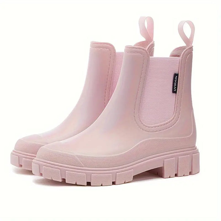 Women's slip-on Chelsea boots with elastic sides and lug soles