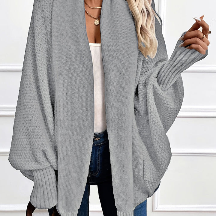 Women's draped open-front cardigan with shawl collar and ribbed cuffs