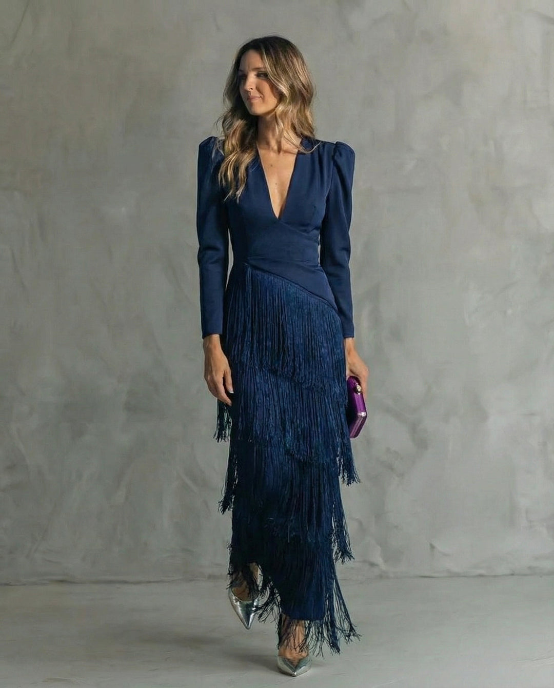Women's long-sleeve maxi dress with deep V-neck and layered fringe skirt