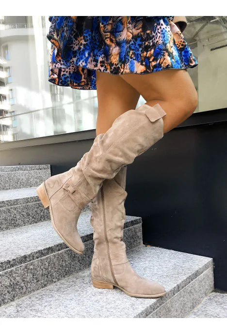 Women's high slouchy tube boots with flat heels and strap details