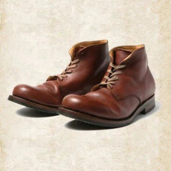 Black and brown lace-up ankle boots with round toes and low heels