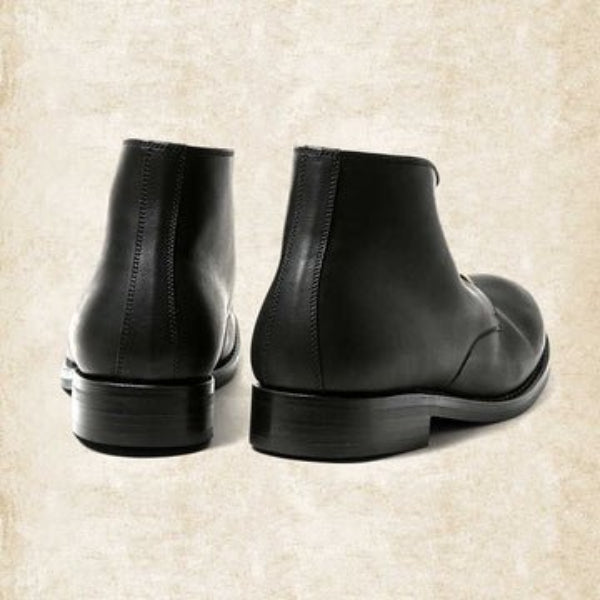 Black and brown lace-up ankle boots with round toes and low heels