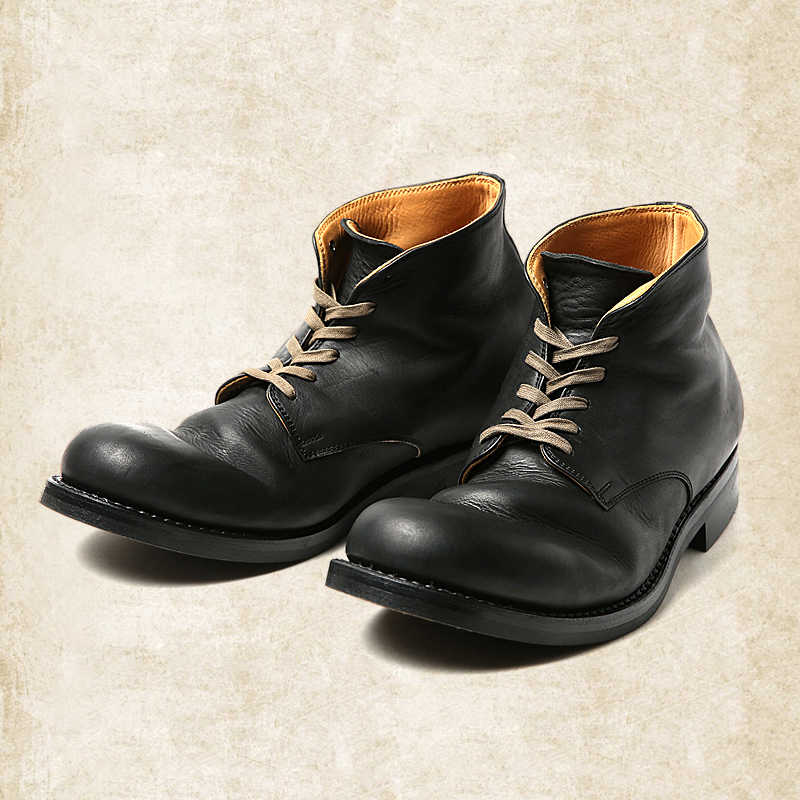 Black and brown lace-up ankle boots with round toes and low heels