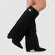 Women's black faux leather over-the-knee boots with buckle detail