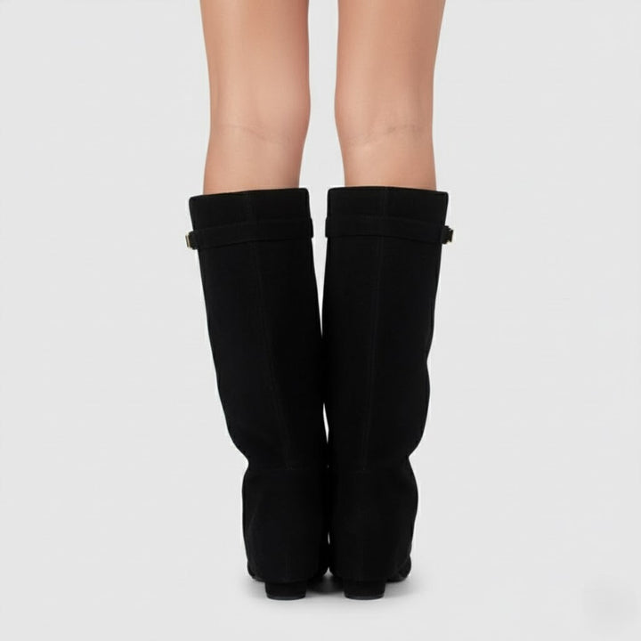Women's black faux leather over-the-knee boots with buckle detail