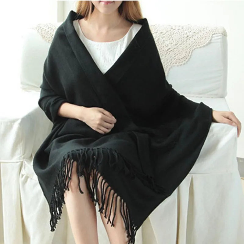 Oversized fringed scarf shown draped around the neck in checked and plain variations