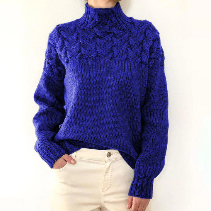 Women's cable knit turtleneck sweater with long sleeves and ribbed trims