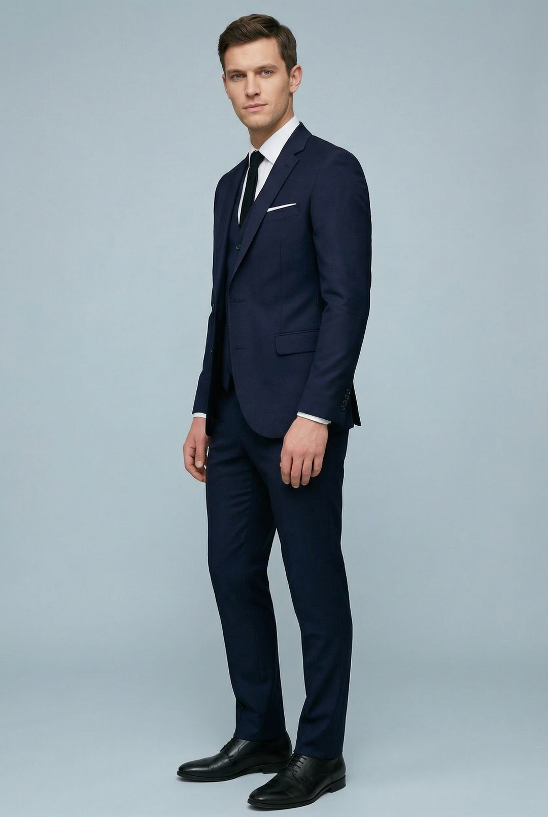 Men's three-piece slim fit suit with tailored jacket and buttoned waistcoat
