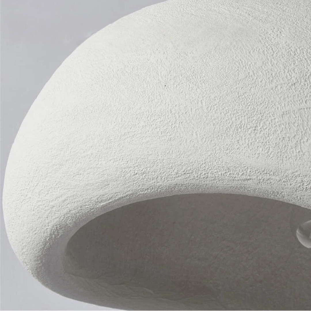 Dome pendant light with warm gold-toned interior and visible bulb
