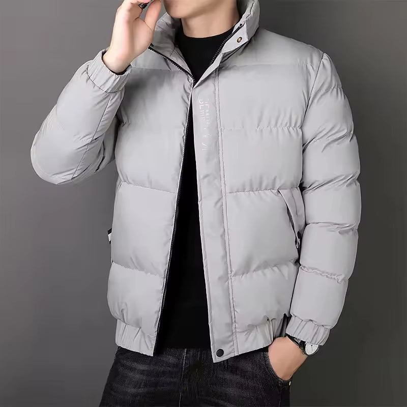 Men's padded quilted jacket with stand collar, long sleeves and zipped pockets