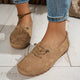 Women's low-profile lace-up moccasin shoes with stitched trim and flat textured soles