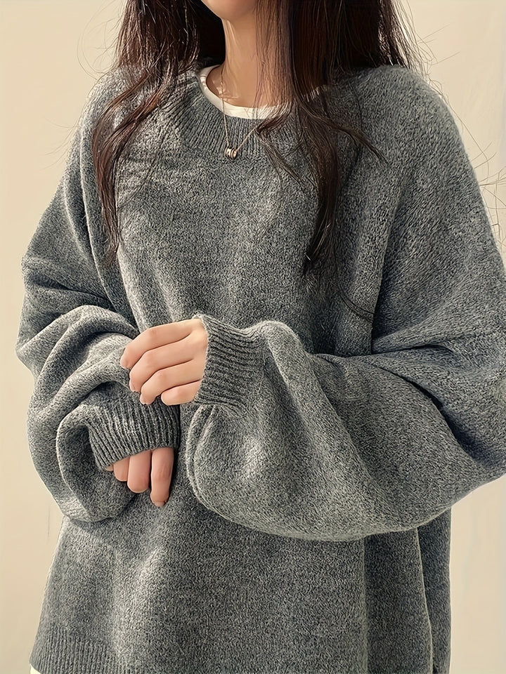 Women's loose crew neck jumper with long sleeves, ribbed trims and split hem