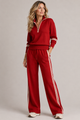 Women's zip sweater and wide-leg trouser set with contrast stripes