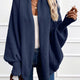 Women's draped open-front cardigan with shawl collar and ribbed cuffs