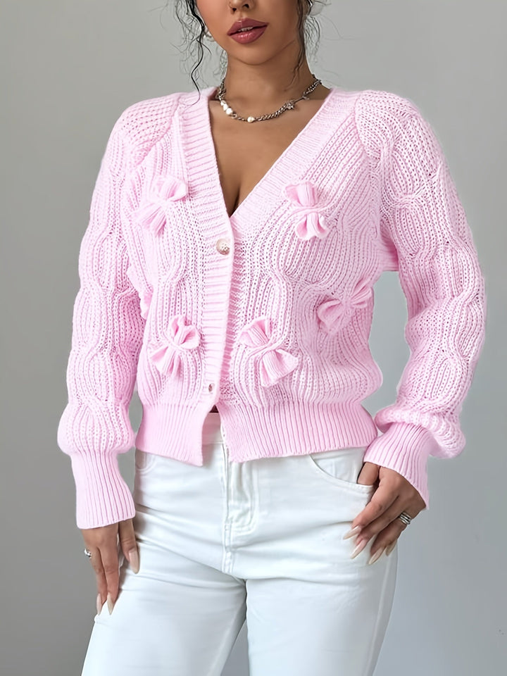 Women's ribbed V-neck cardigan with bow details and button front