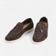 Men's textured slip-on loafers with flat soles, stitched apron detail and decorative toggle trim