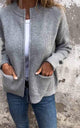 Women's knitted zip jacket with ribbed collar, long sleeves and front pockets