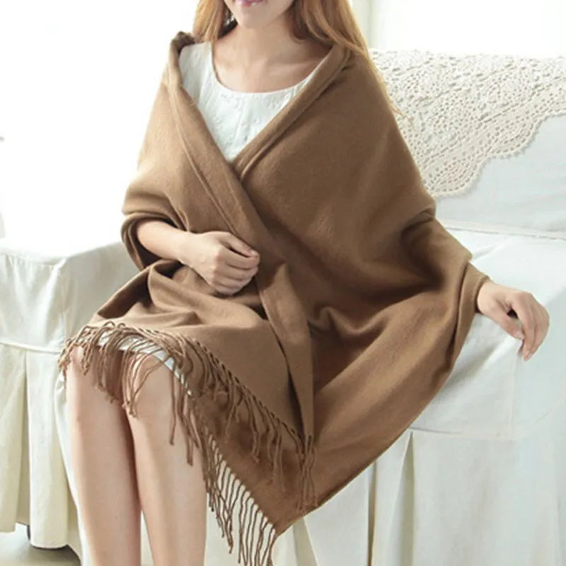 Oversized fringed scarf shown draped around the neck in checked and plain variations