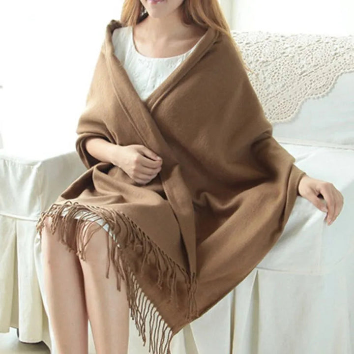 Oversized fringed scarf shown draped around the neck in checked and plain variations