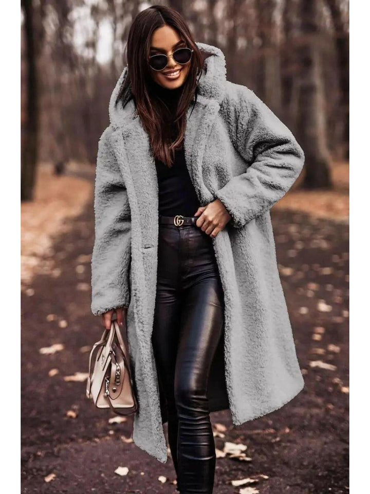 Women's longline hooded teddy coat with long sleeves and front pockets