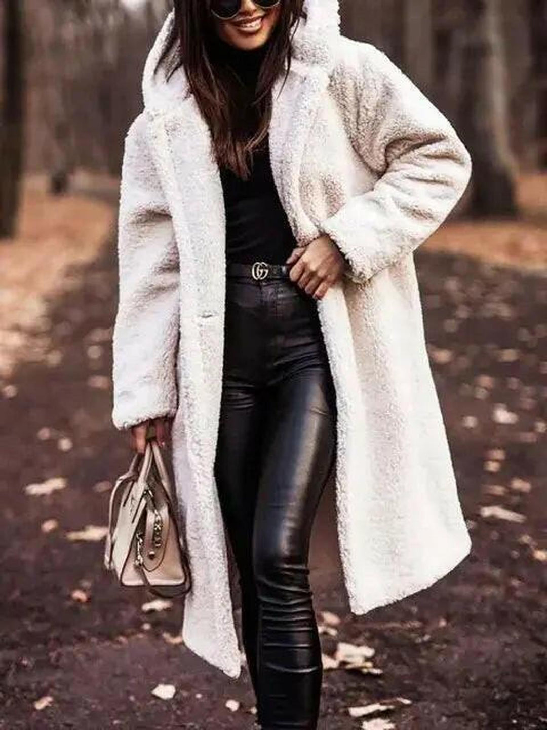 Women's longline hooded teddy coat with long sleeves and front pockets