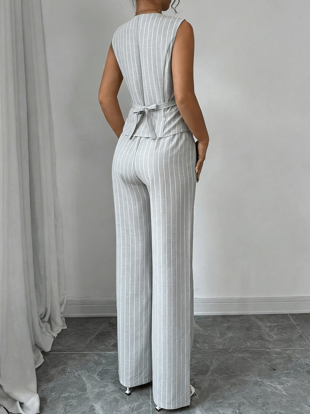 Women's pinstripe sleeveless vest and wide-leg trouser set with V-neck and button front