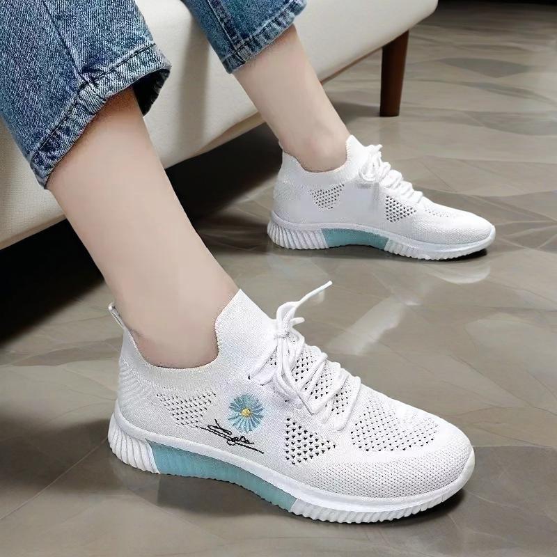 Women's textured lace-up sneakers with floral side detail and ridged soles