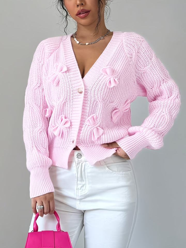 Women's ribbed V-neck cardigan with bow details and button front