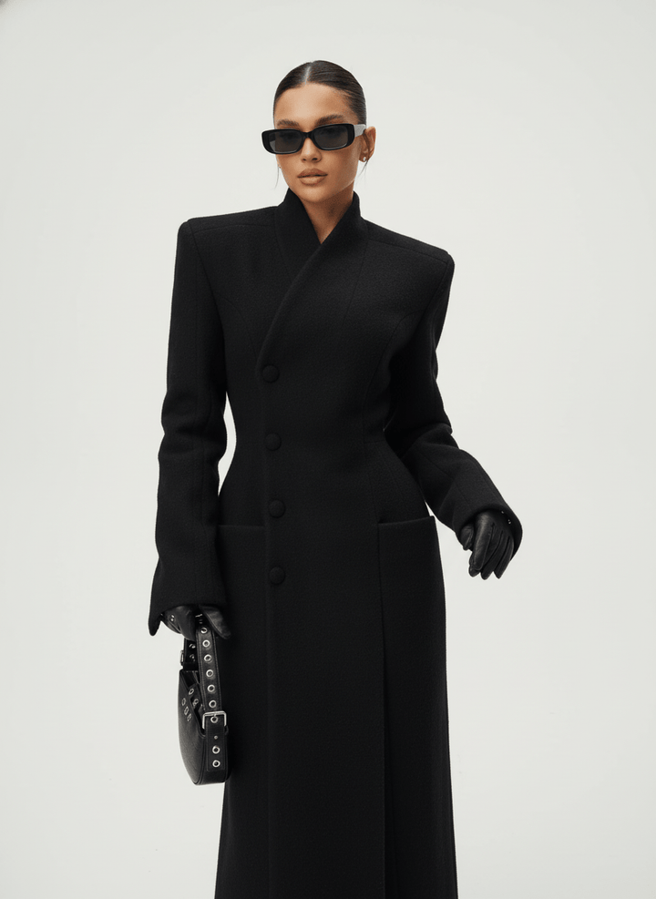 Women's black tailored maxi coat with high collar, button front and flap pockets