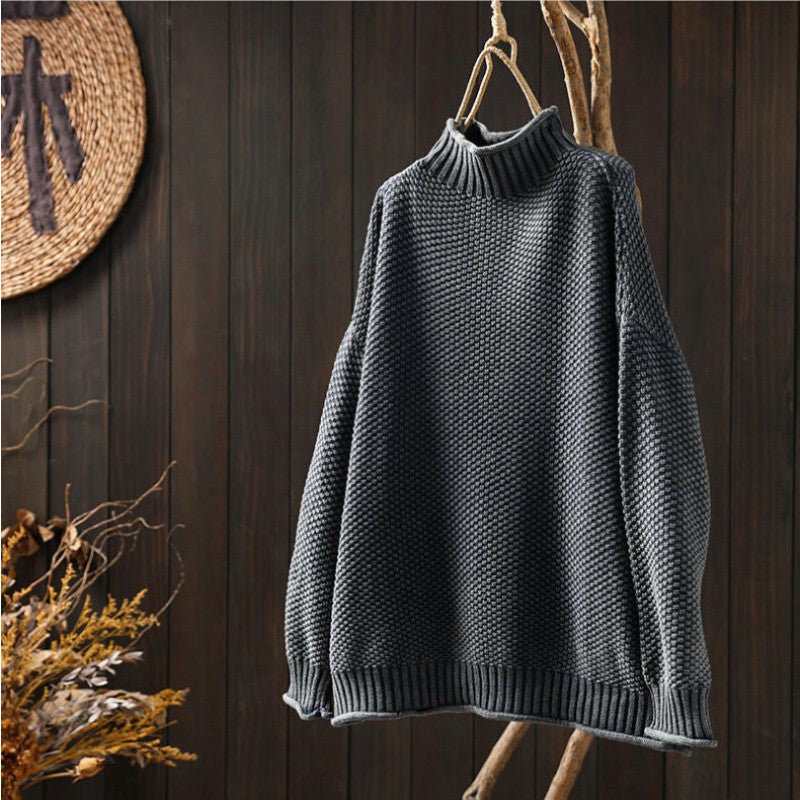 Women's textured knit sweater with ribbed crew neck and long sleeves