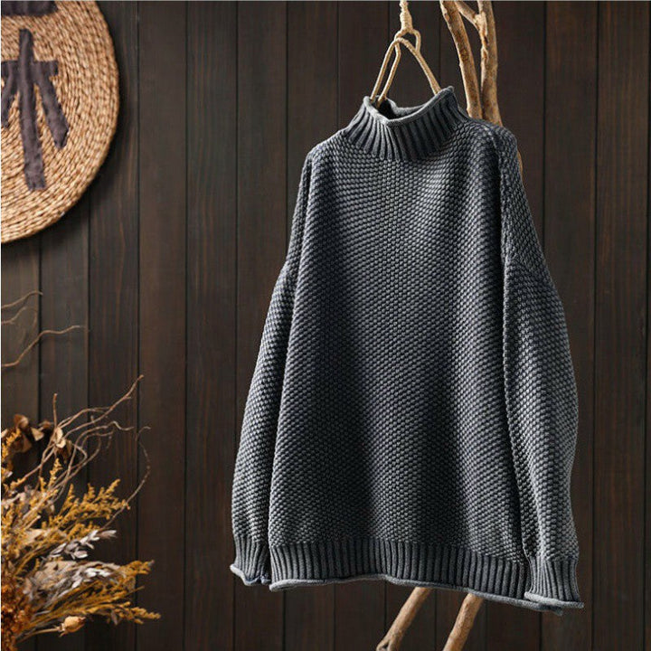 Women's textured knit sweater with ribbed crew neck and long sleeves