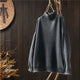 Women's textured knit sweater with ribbed crew neck and long sleeves