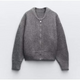 Women's zip-up knit cardigan with high collar and long sleeves