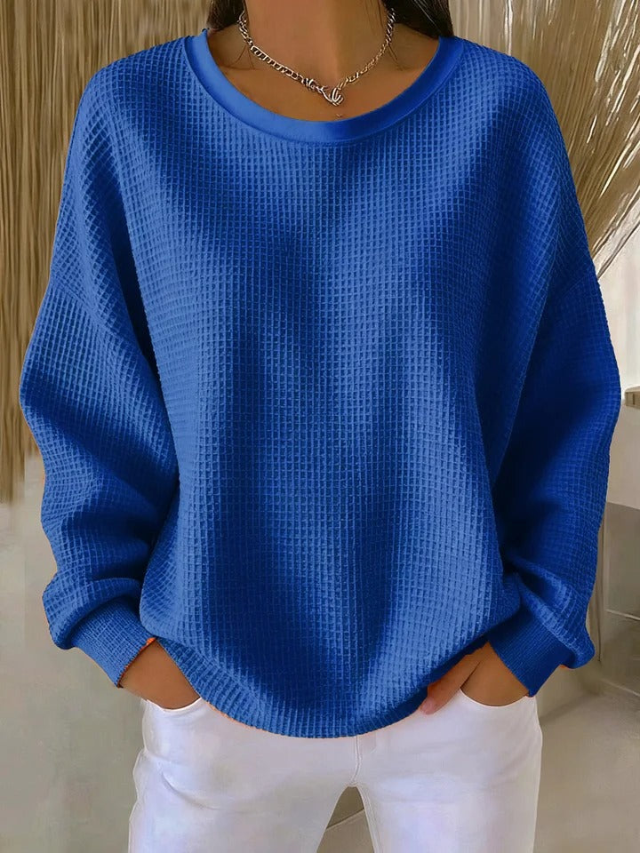 Women's textured crew neck sweater with long sleeves and ribbed cuffs
