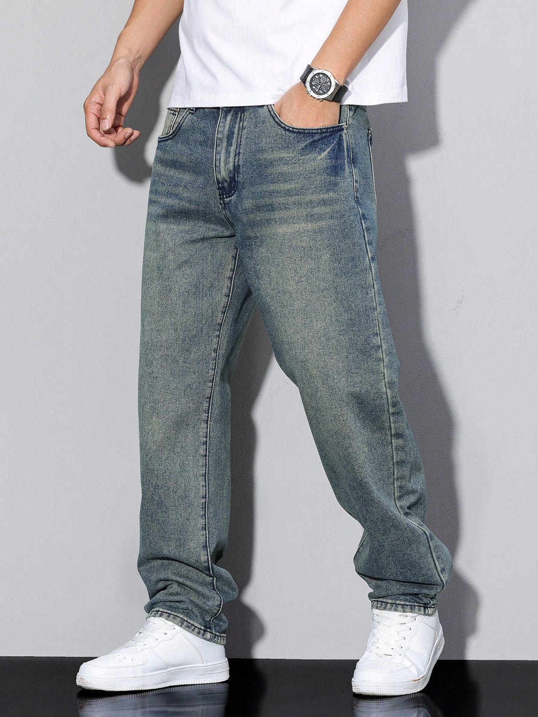 Men's straight fit full-length jeans with a mid-rise waist and front pockets