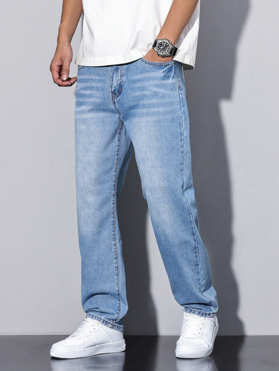 Men's straight fit full-length jeans with a mid-rise waist and front pockets