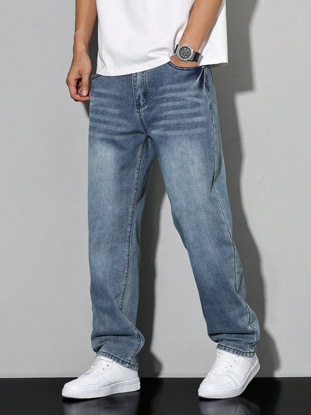 Men's straight fit full-length jeans with a mid-rise waist and front pockets