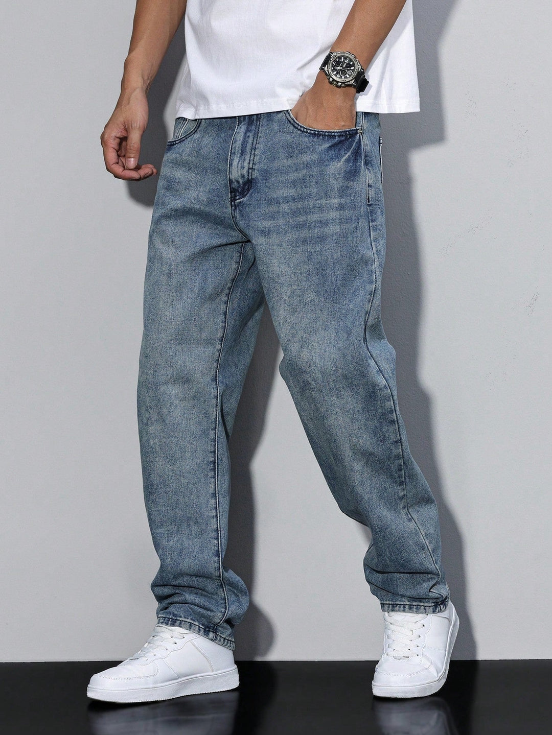 Men's straight fit full-length jeans with a mid-rise waist and front pockets