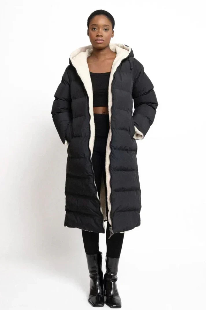 Women's long hooded quilted coat with textured lining and full-length silhouette