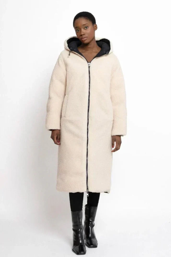 Women's long hooded quilted coat with textured lining and full-length silhouette
