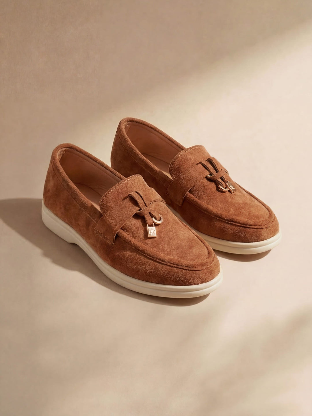 Women's pointed toe loafers with tassel detail