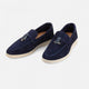 Men's textured slip-on loafers with flat soles, stitched apron detail and decorative toggle trim
