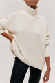 Women's oversized turtleneck sweater with ribbed trims and three-quarter sleeves