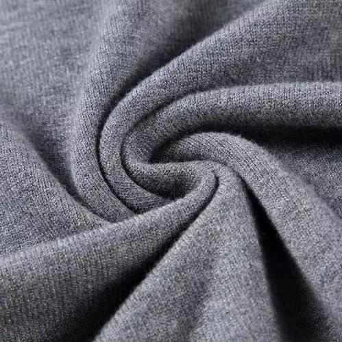 Folded plain knit turtleneck sweater with ribbed collar and cuffs