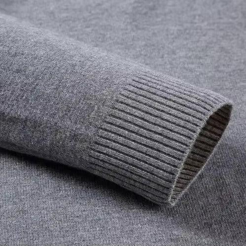 Folded plain knit turtleneck sweater with ribbed collar and cuffs